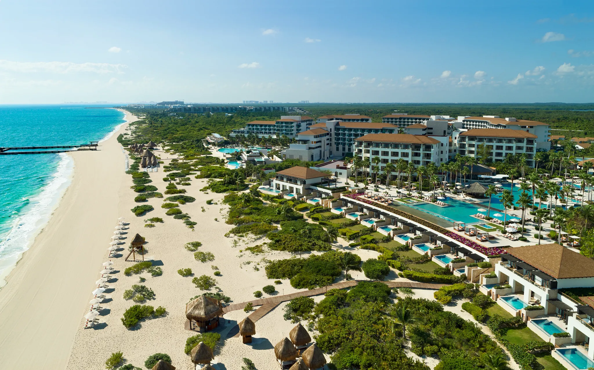 Aerial view of the white-sand beach and turquoise Caribbean water at Dreams Playa Mujeres
