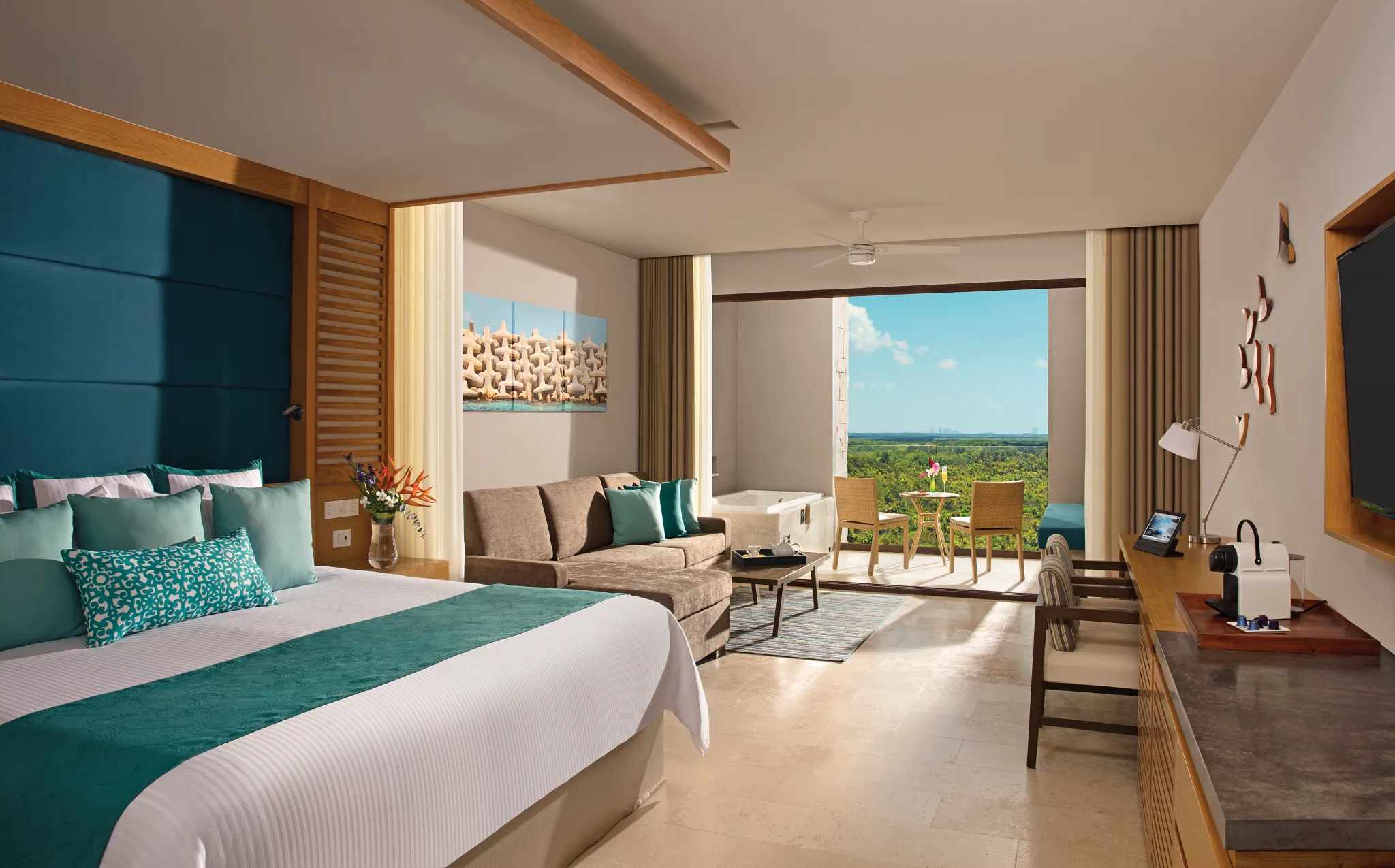 Junior suite with an open terrace looking out over lush green grounds