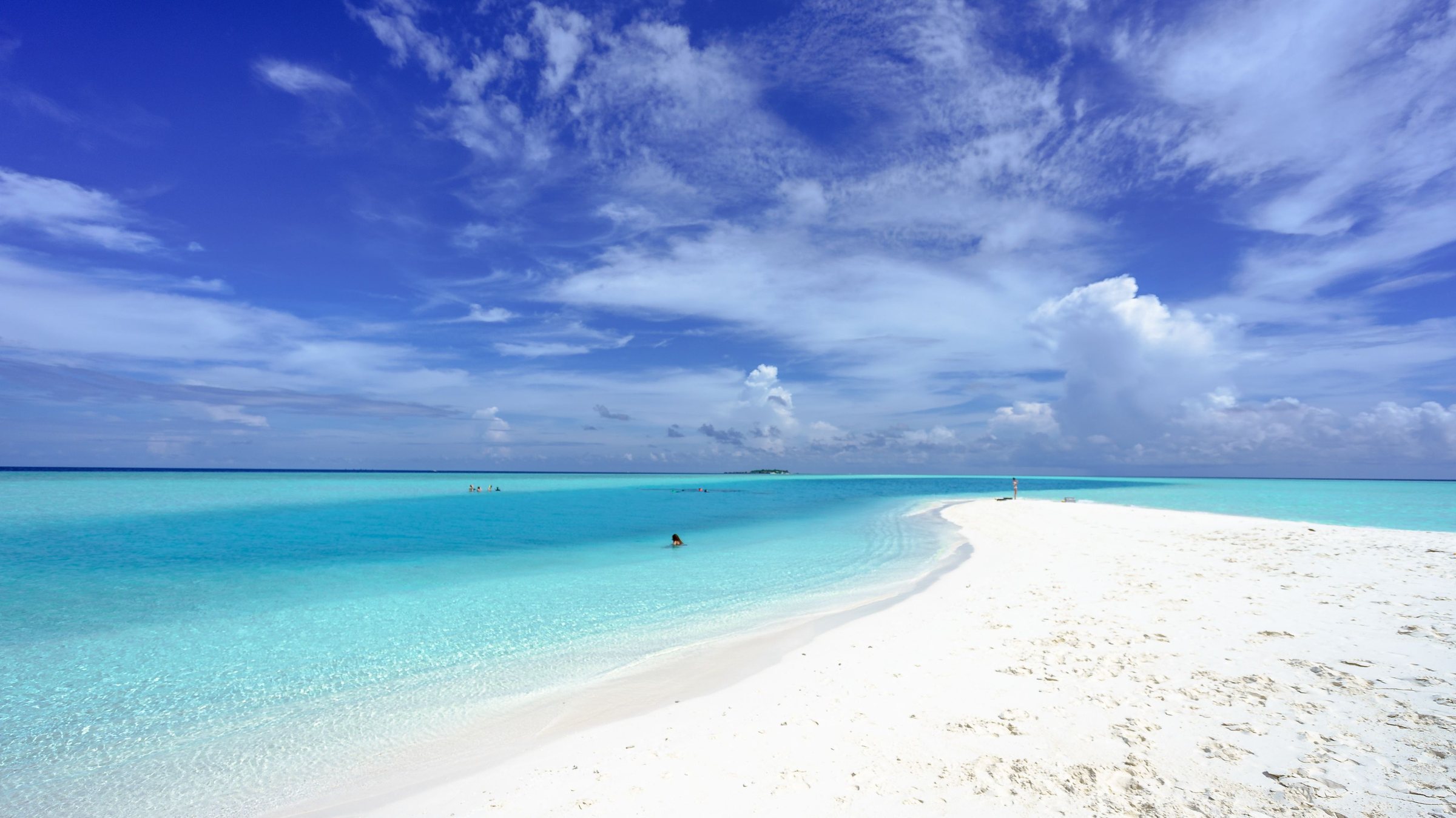 White sand, turquoise water and open sky on the beach at Dreams Playa Mujeres